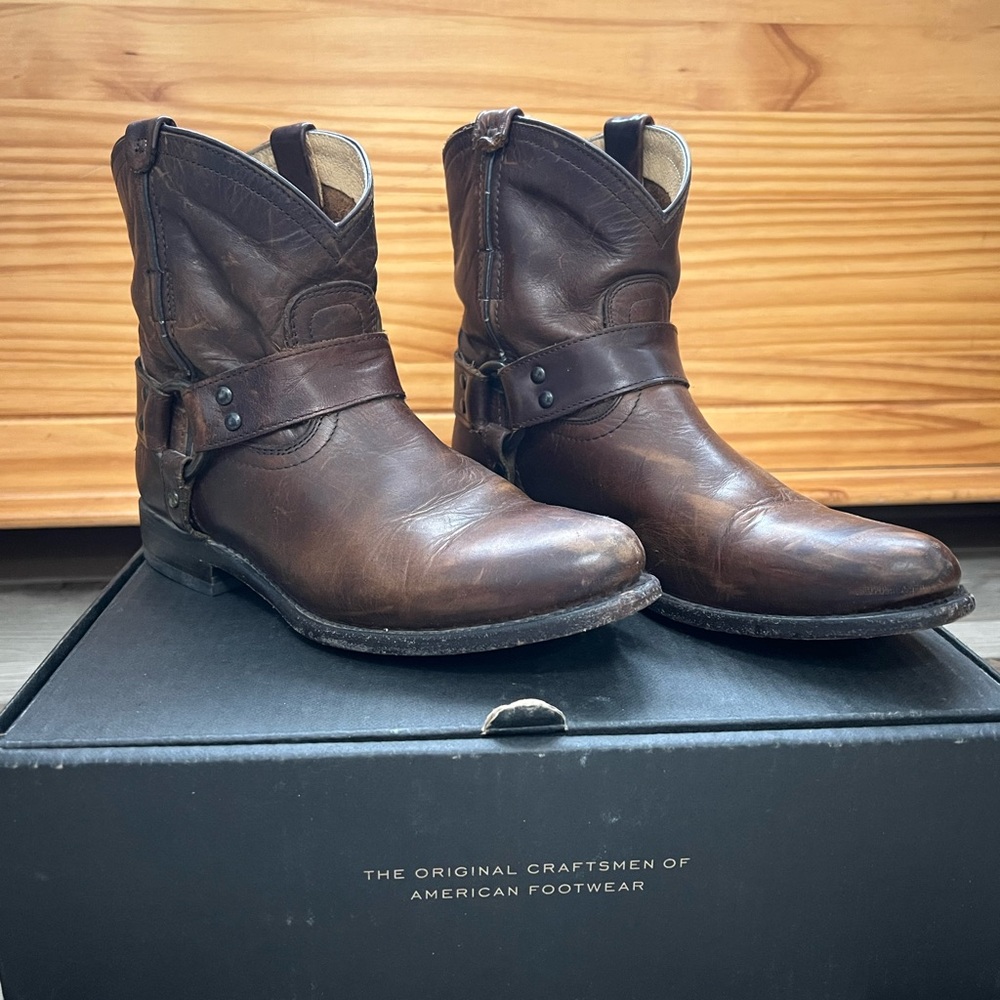 Brown Harness Frye boots.